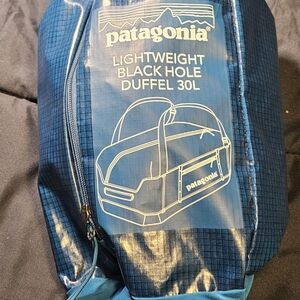 Patagonia Black and Blue Duffel Bag